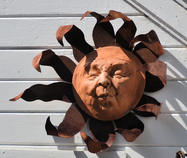 Sun sculpture on side of house in Mendocino, California